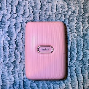 I am selling a instax Fuji film mini printer.It is like a baby pink color .